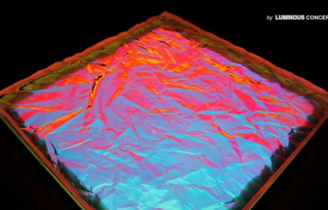 Image of lava-like blue-red surface illuminated by Luminous Concepts